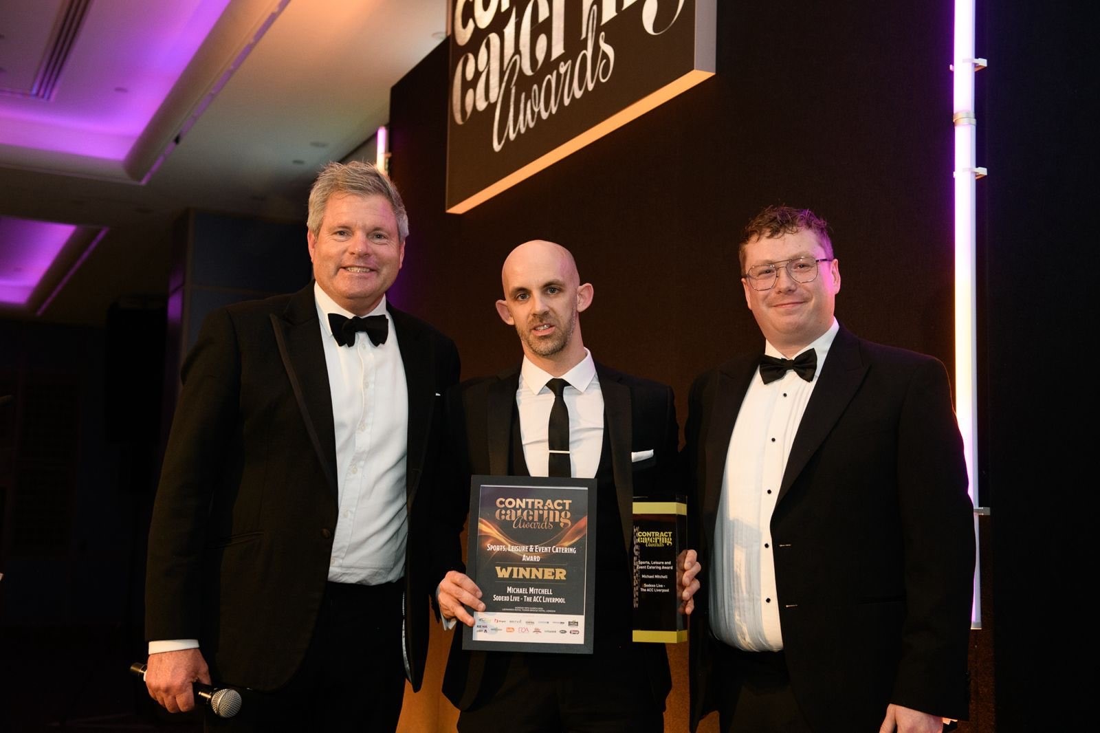 Sodexo Live!'s Mitch (centre) accepting the award for sports, leisure and event catering award