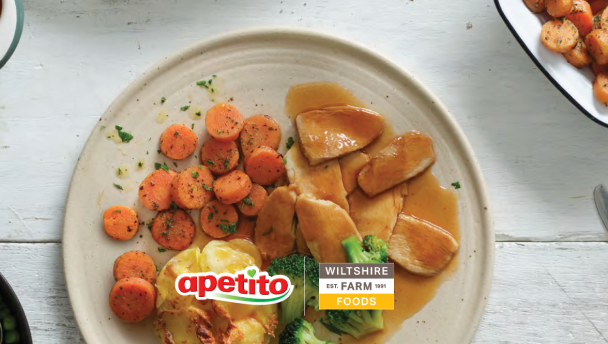 A hearty plate of carrots, potatoes, and gravy. Over the image there is the Apetito logo. 